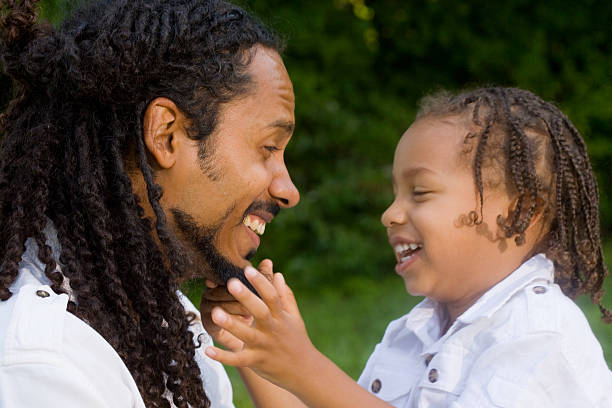 istock African-American father and son laughing 173003196