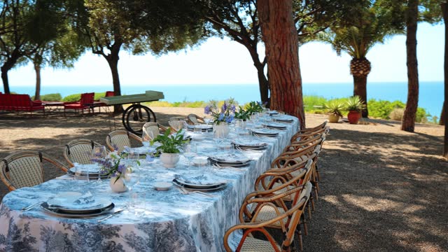 Outdoor lunch table setting by the beach