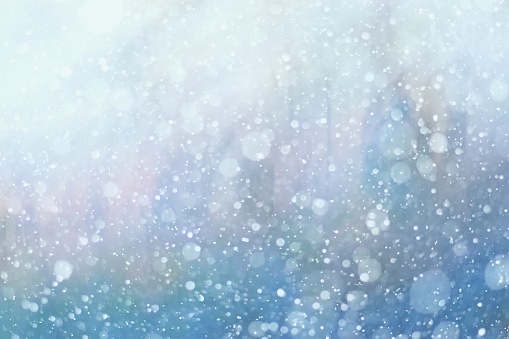Close up of fresh powder snow framed by a soft circle bokeh. Beautiful fresh winter Christmas background.