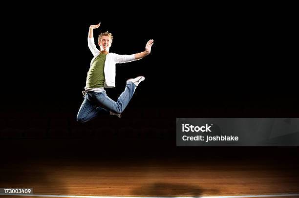 Leaping On Stage Stock Photo - Download Image Now - Black Background, Dancing, Jumping