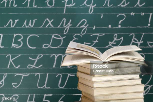 Books In Front Of A Blackboard Stock Photo - Download Image Now - Spelling - Education, Chalkboard - Visual Aid, Handwriting