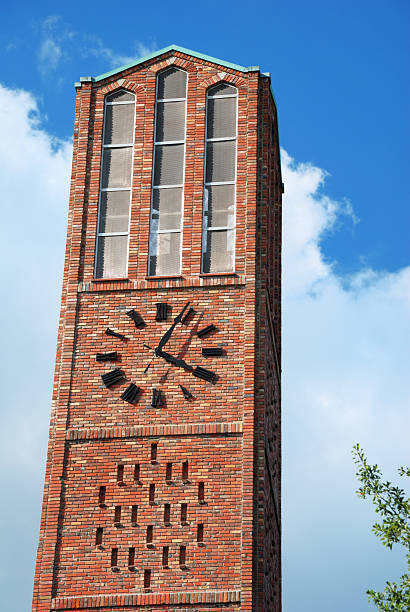 Brick bell tower Close up of clock on bell tower mississippi state university stock pictures, royalty-free photos & images