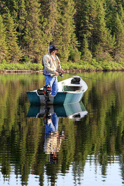 istock Fisherman fishing on a Quiet Lake 173004093