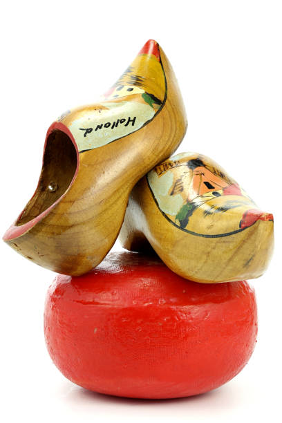 Edam cheese wheel with nostalgic Dutch souvenir clogs