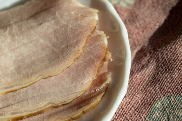 istock Sliced tenderloin on a plate. On the table. Tablecloth. Breakfast. 1730043601
