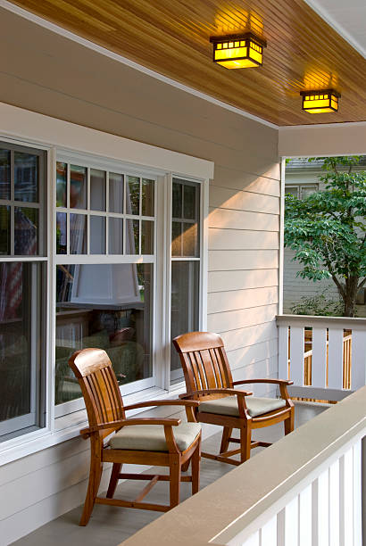 istock Bungalow with front porch and two chairs 173004428