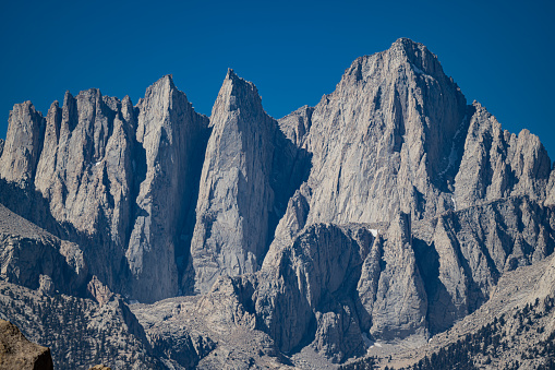 Mount Whitney from the Alabama Hills, a range of hills and rock formations near the eastern slope of the Sierra Nevada in the Owens Valley, west of Lone Pine in Inyo County, California. The Sierra Nevada Mountains are in the back round with Mount Whitney.