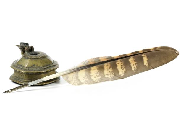 istock falcon quill pen and inkwell 1730051526