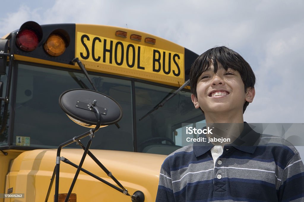 happy school boy happy boy in front of a school bus.  Please view all these along with all 14-15 Years Stock Photo