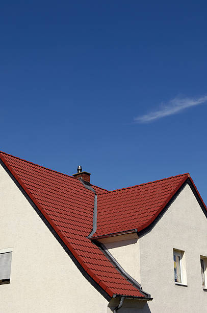 istock New red roof and blue sky 173005664