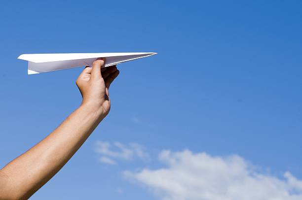 paper airplane stock photo