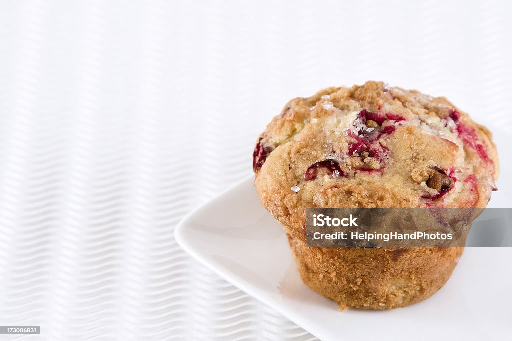 Cranberry Muffin Cranberry muffin with struesel top on white textured background - shallow depth of field.  Baking Stock Photo