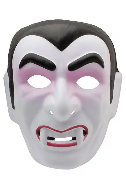 "A Halloween vampire mask, isolated on a pure white background. There was no copyright information anywhere on the product or on the tag. The mask is made of a thin textured foam material. More masks..."