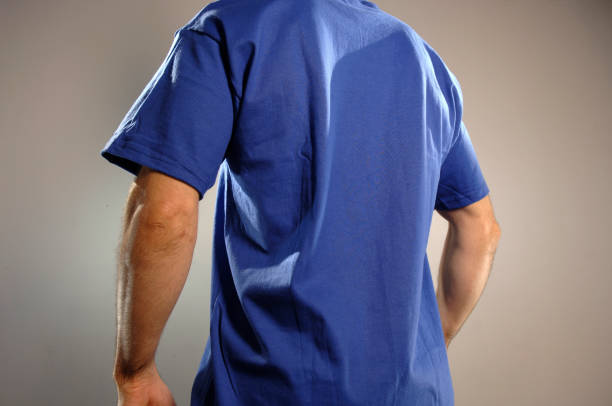 Selective focus image of a man wearing a plain blue t-shirt