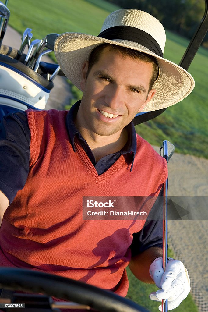 golf player golf player/teacher in his cart / smiling, Adult Stock Photo