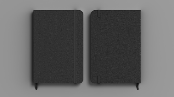 Black cover notebook mockup on gray background. Front and back view of the notebook cover. 3d illustration