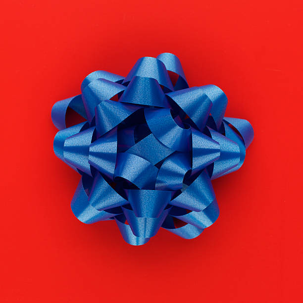 istock Blue ribbon isolated on red background 173008059