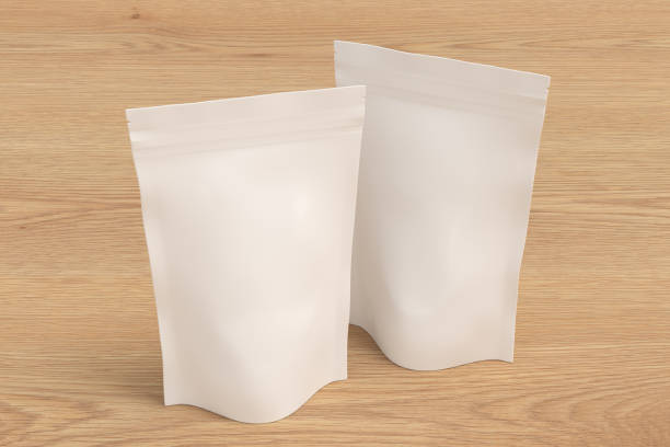 istock White packaging pouches mockup for tea, coffee, snack on wooden background 1730085055