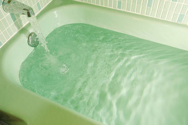 Tub filling up stock photo
