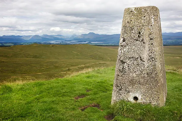 The Ordnance Survey triangulation point marking the highest point in the Kilpatrick Hills on top of Duncolm.  Loch Lomond is in the background.See also: