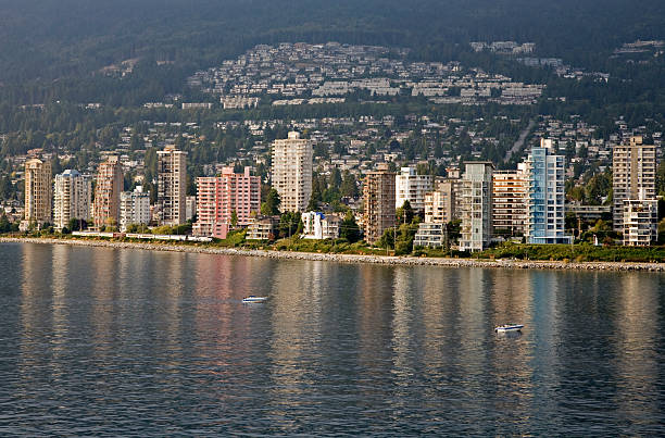 West Vancouver High Rises and Condominiums West Vancouver at sunset with high rise condominiums visible in foreground. west vancouver stock pictures, royalty-free photos & images