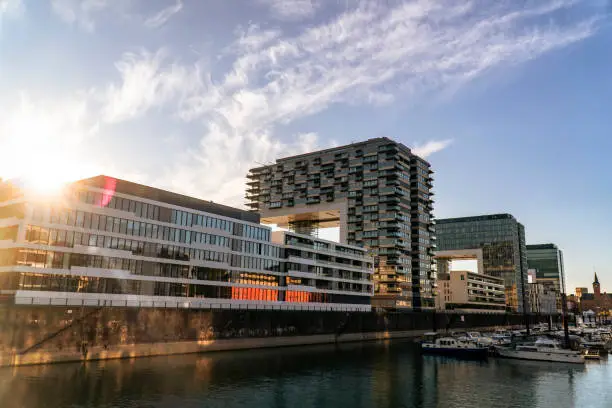 Photo of Cologne Kranhaus business center 
on the Rheinauhafen waterfront in sunny morning