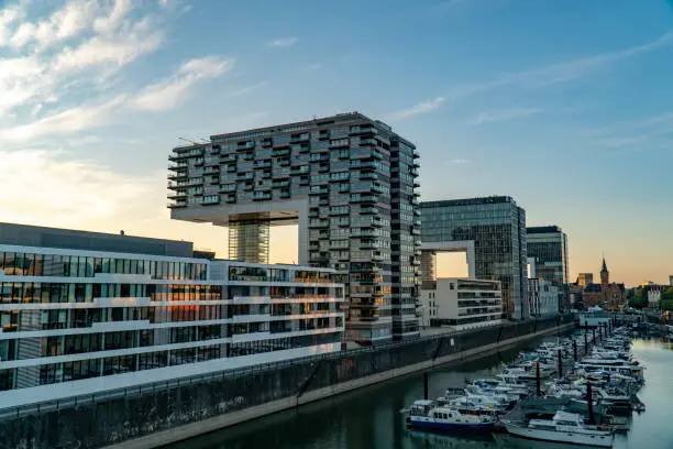 Photo of Cologne Kranhaus business center 
on the Rheinauhafen waterfront in sunny morning