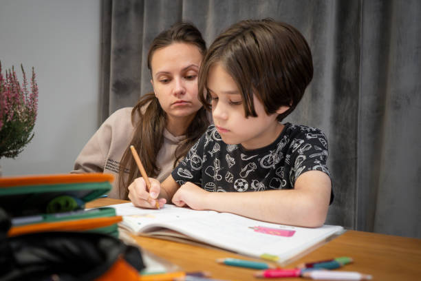 istock Mom and child are doing homework. 1730098333