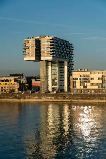 Photo of Cologne Kranhaus business center 
on the Rheinauhafen waterfront in sunny morning