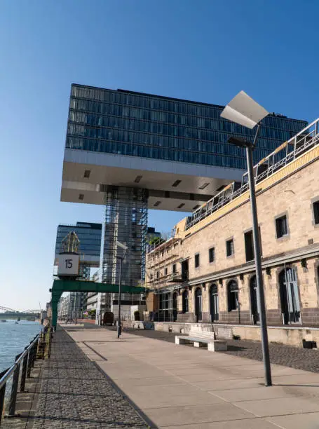 Photo of Cologne Kranhaus business center 
on the Rheinauhafen waterfront in sunny morning