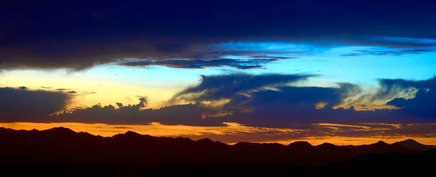 istock the sun is going down over a valley with hills behind it 1730102290