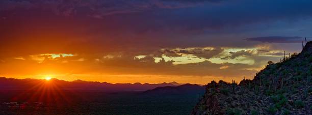 istock a sunset in the mountains with some clouds in the sky 1730102295