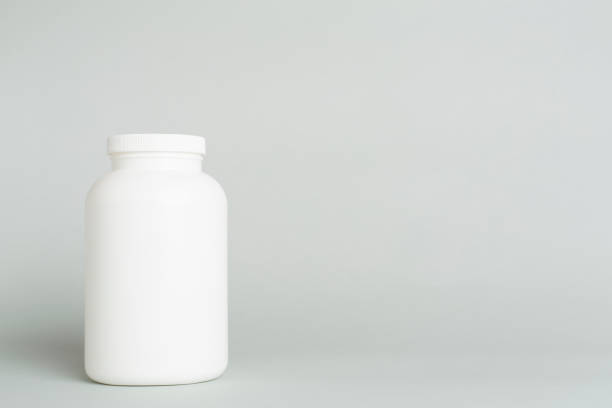 istock Plastic bottle for vitamins on color background 1730103582