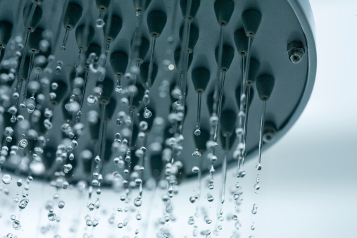 Cloeup of a showerhead with frozen water droplets.see also: