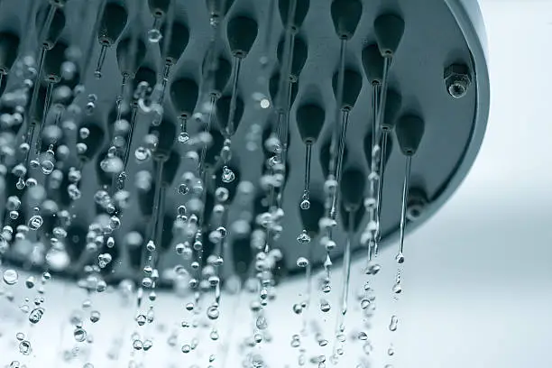 Cloeup of a showerhead with frozen water droplets.see also: