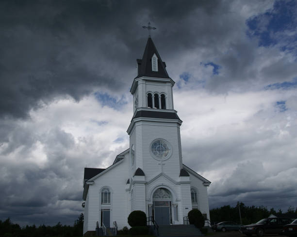 istock White Church and Dark Storm Clouds 2H 173011242