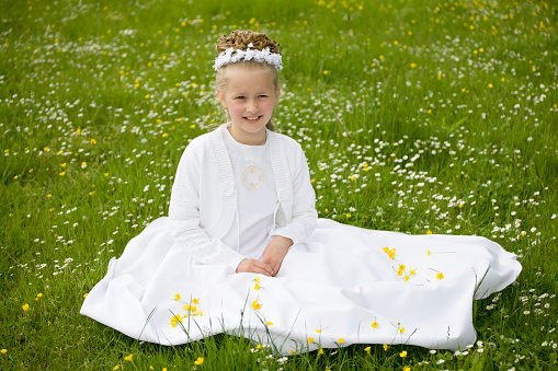 girl wearing first communion dress