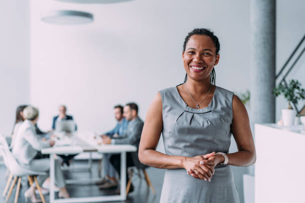 istock Confident businesswoman and her team. 1730119685