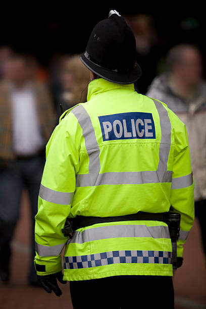 istock British Policeman in Traditional Helmet Watches over Crowd. More below... 173012148