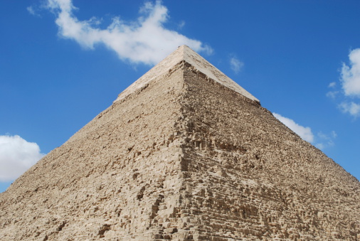 Giza, Cairo, Egypt - Aug 4, 1991: Close-up view of the impressive grandeur and majesty of the Great Pyramid of Cheops.