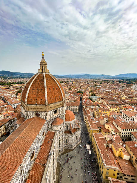 Brunelleschi's Dome and city skyline from above in Florence, Italy Aerial city view of Florence, Italy with famous Santa Maria del Fiore Cathedral and Brunelleschi's Dome. filippo brunelleschi stock pictures, royalty-free photos & images