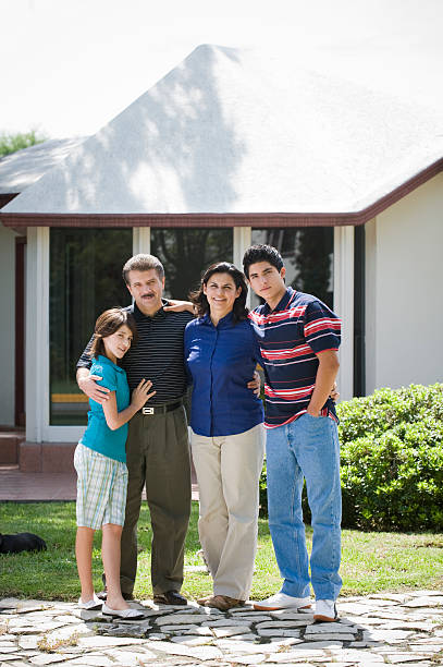 istock family in front of house 173013063