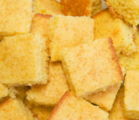 Cornbread cut into squares and ready for serving.Click this link for more