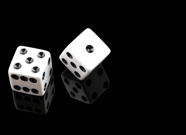 White dice on black stock photo