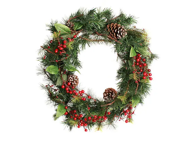 wreath with pinecones and berries isolated on a white background