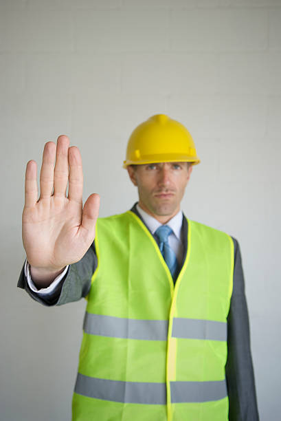 istock Hard Hat Businessman Puts Hand Out 173014561