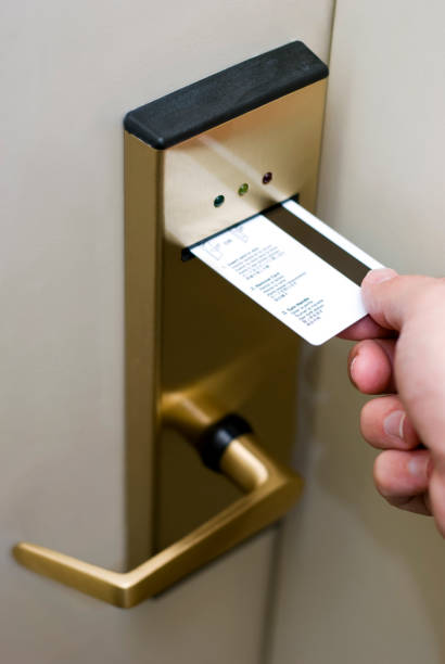 istock Male Hand Inserting Card Key into Electronic Hotel Door Lock 173015157