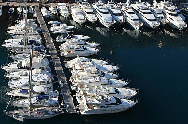 Rows of small luxury yachts in a marina Luxury yachts at Monaco marina. More ... leisure activity french culture sport high angle view stock pictures, royalty-free photos & images