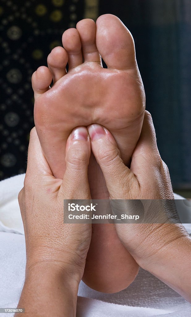 foot massage woman getting a foot massage and pedicure at a day spa Adult Stock Photo