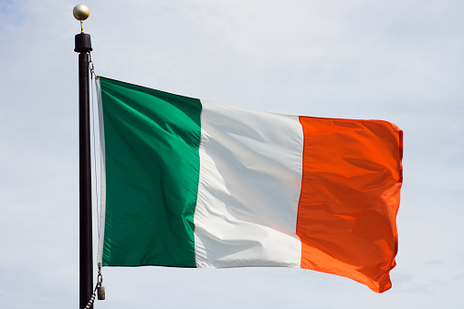 Flag of Ireland, the national Irish banner waving and rippling in the Windy breeze. 
